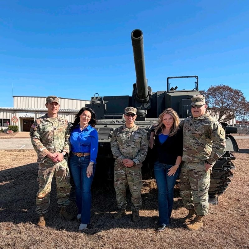 BPK team at an active military base in front of a tank