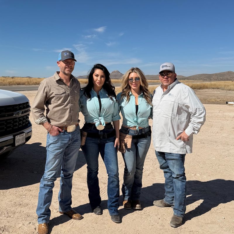 BPK team at a remote energy site against a mountain backdrop