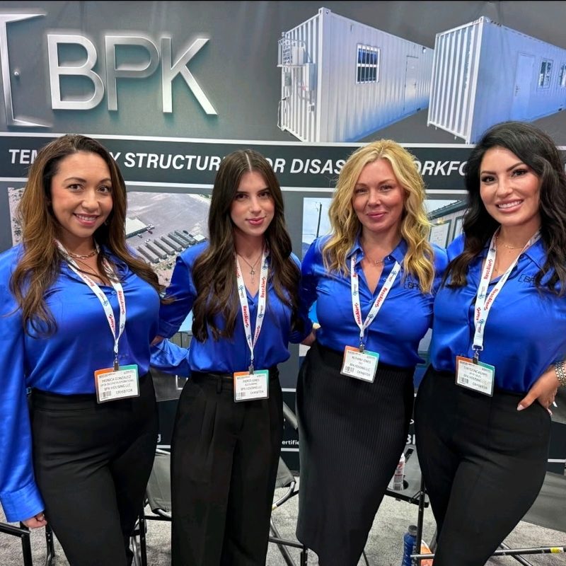 BPK team in matching uniforms at an industry trade show booth