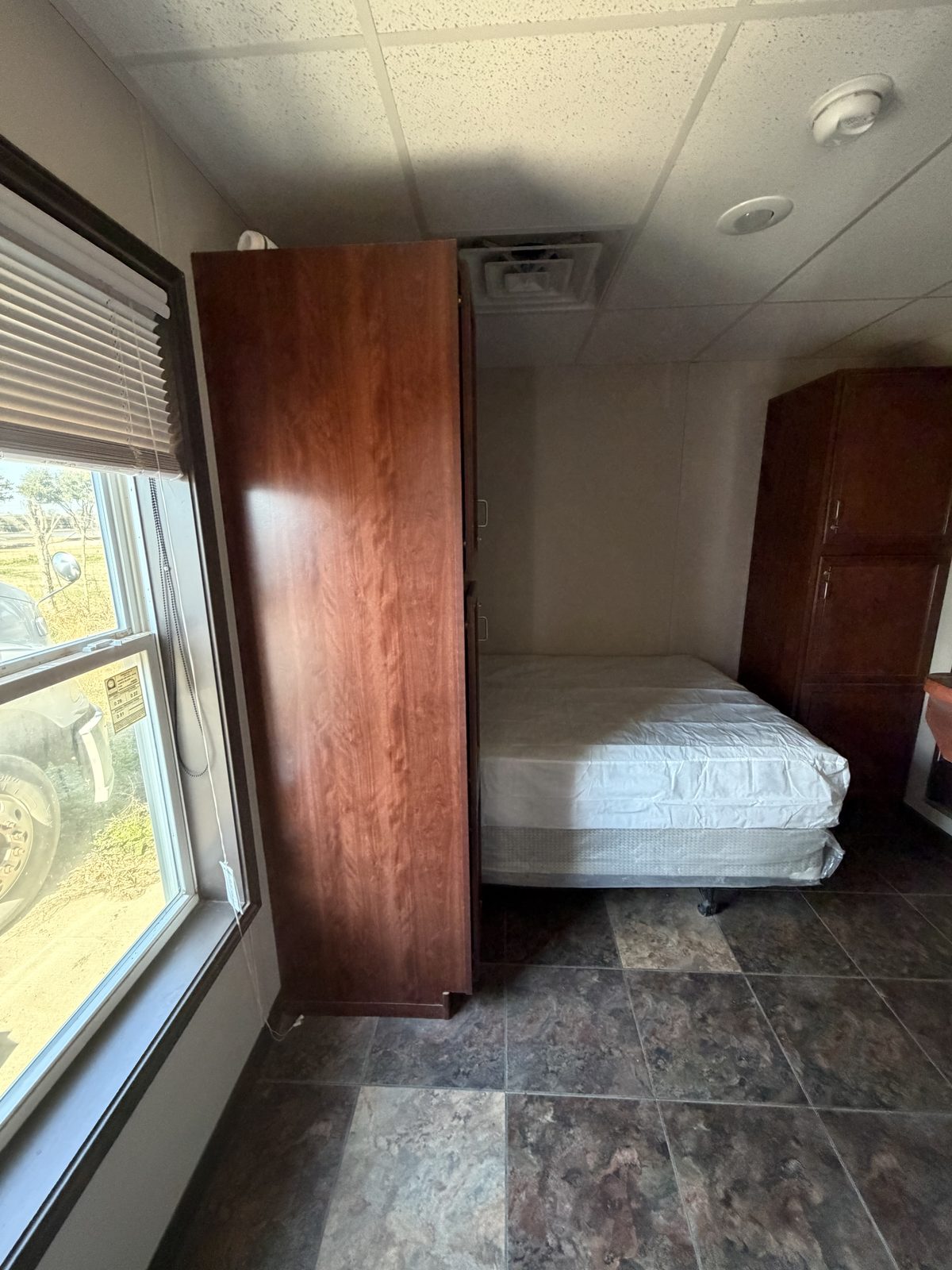 Company Man — bedroom with bed and wardrobe